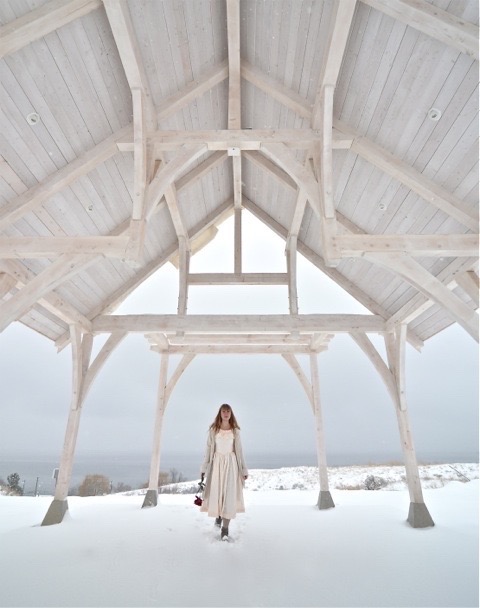 woman standing on a covered area of land filled with snow