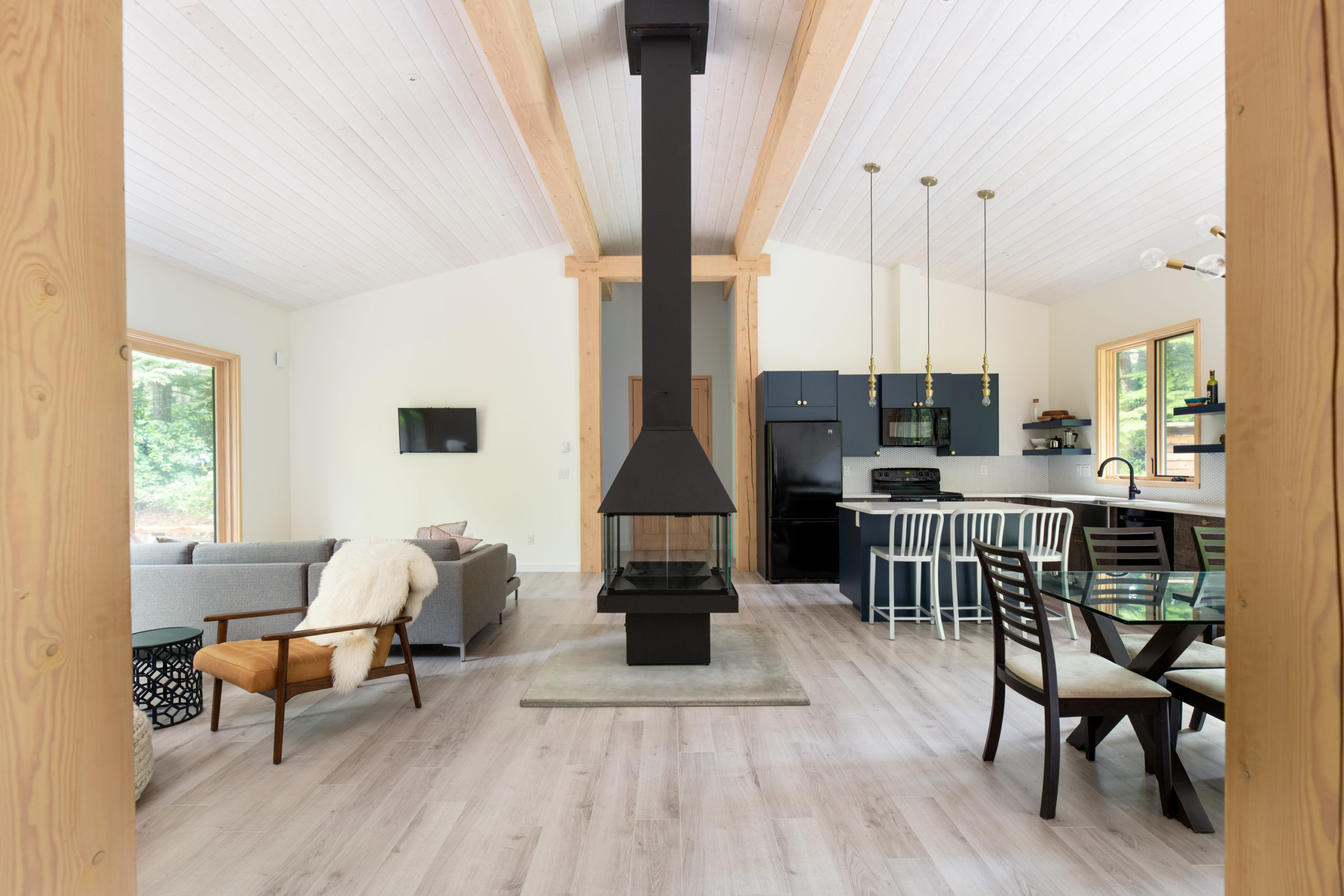 fireplace in the middle of the kitchen, dining, and living area