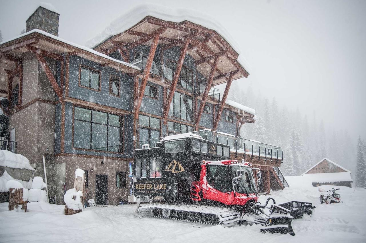 facade of ski lodge during snowfall in the morning