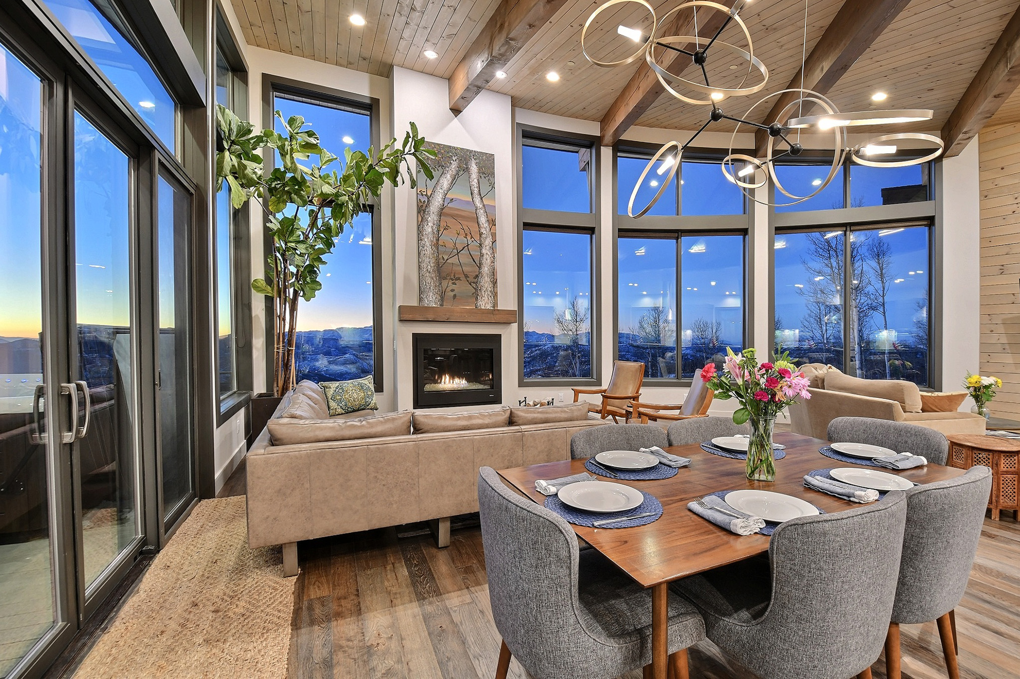 dining beside the living area and fireplace of a contemporary house