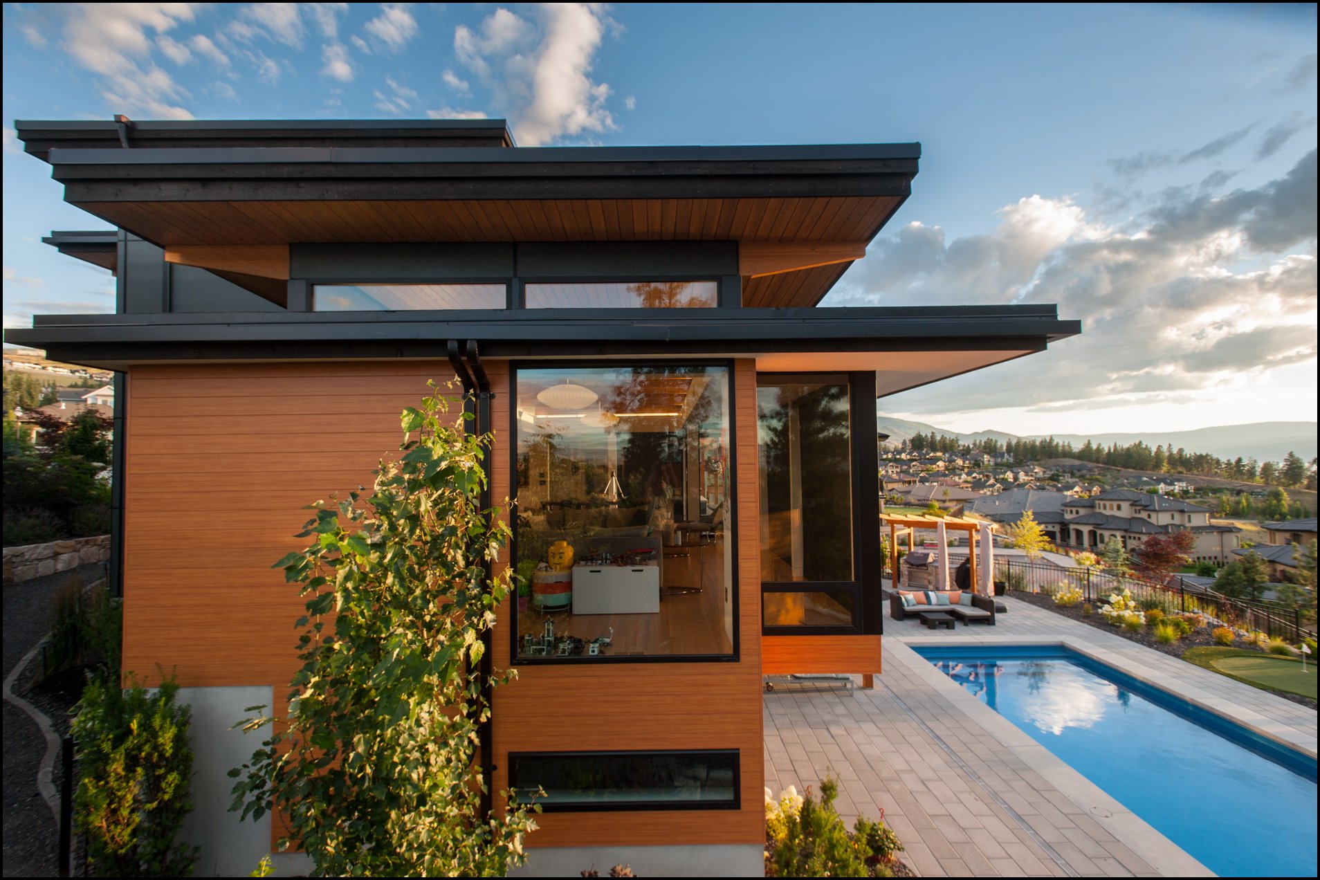 side area of a contemporary house with a pool