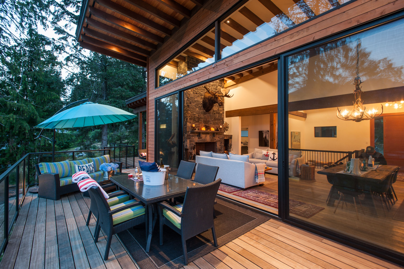 deck of a beach house with table and chairs