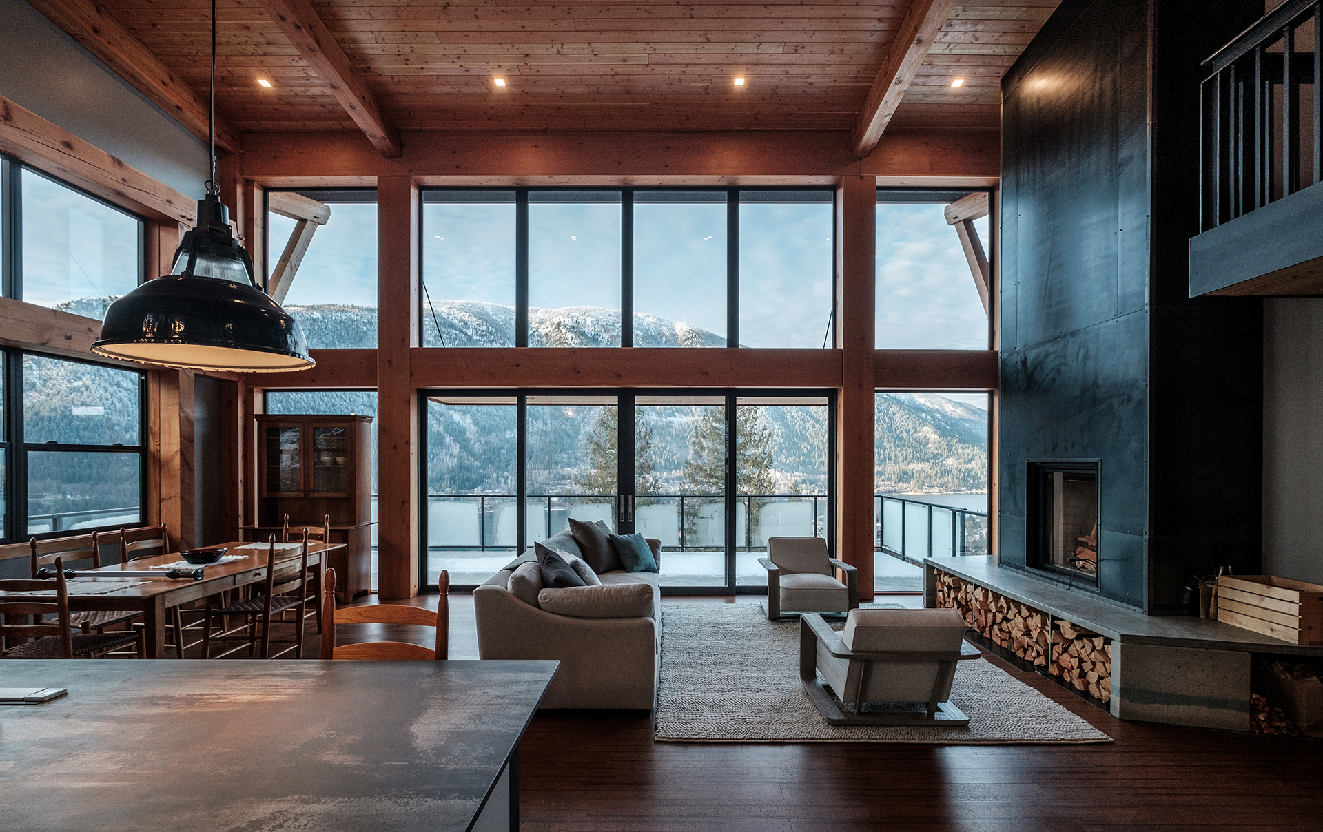 dining and living area with fireplace and a view of the mountains