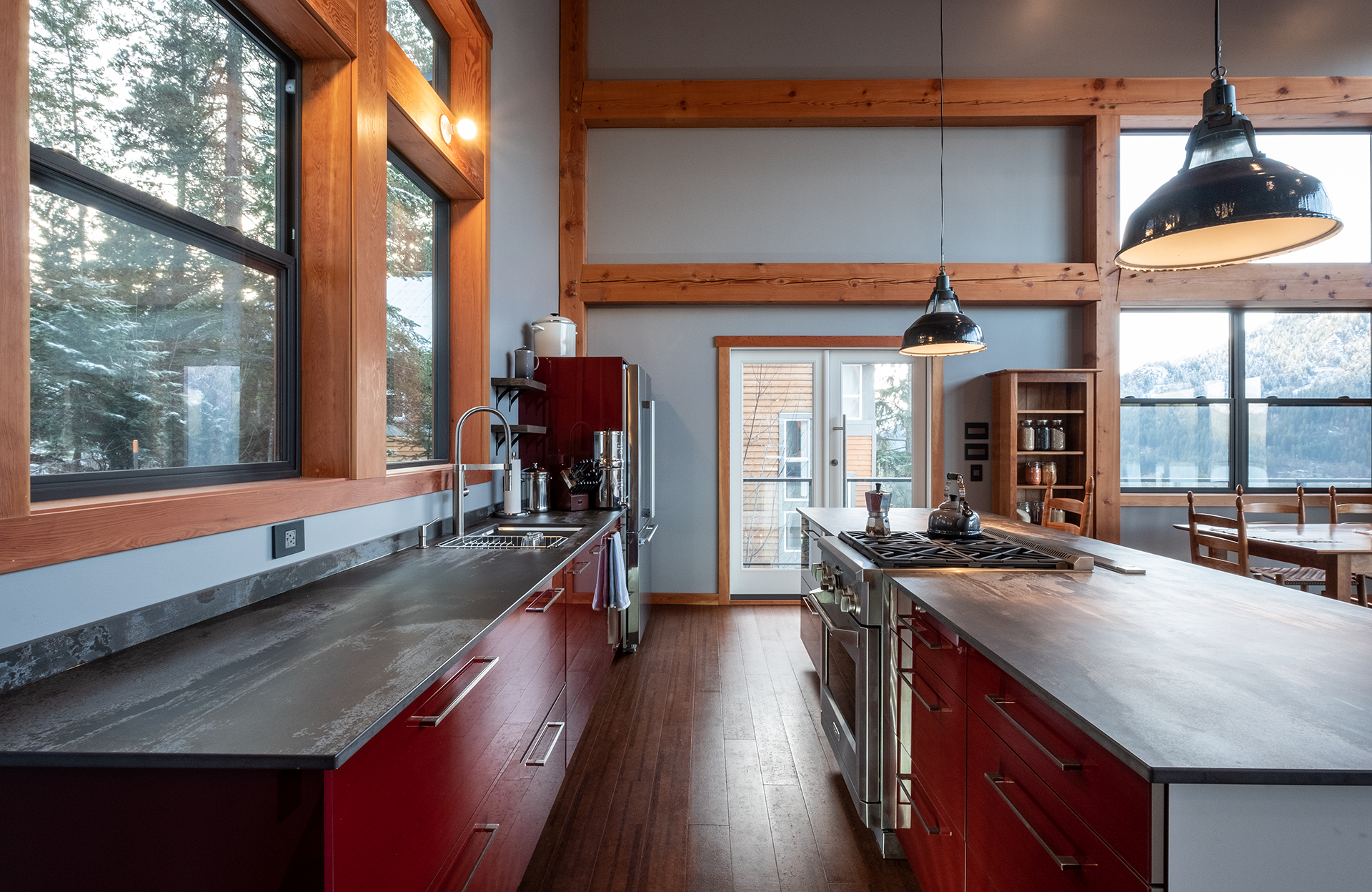 kitchen bar with red accents of Pacific Northwest house