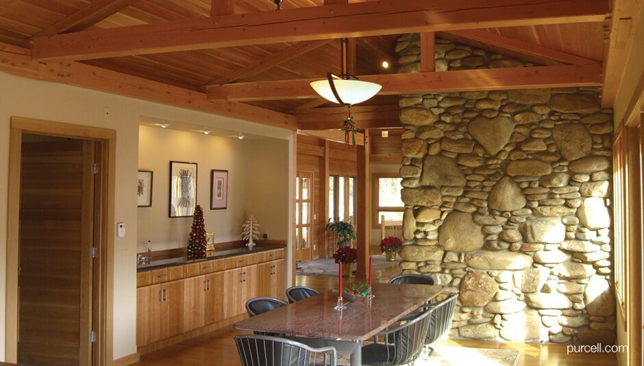 small dining area near the sink and a corner wall with stone accent