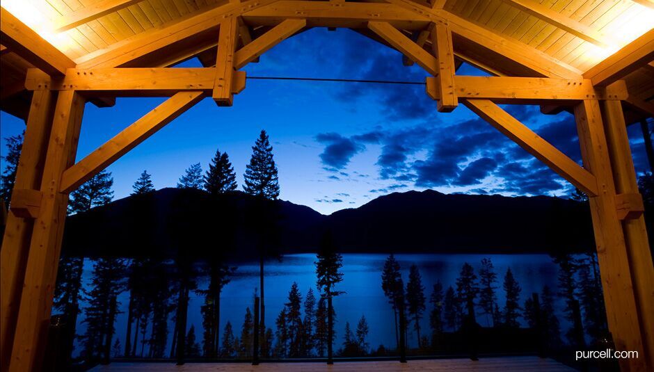 view of the lake and the mountain from the balcony at dusk